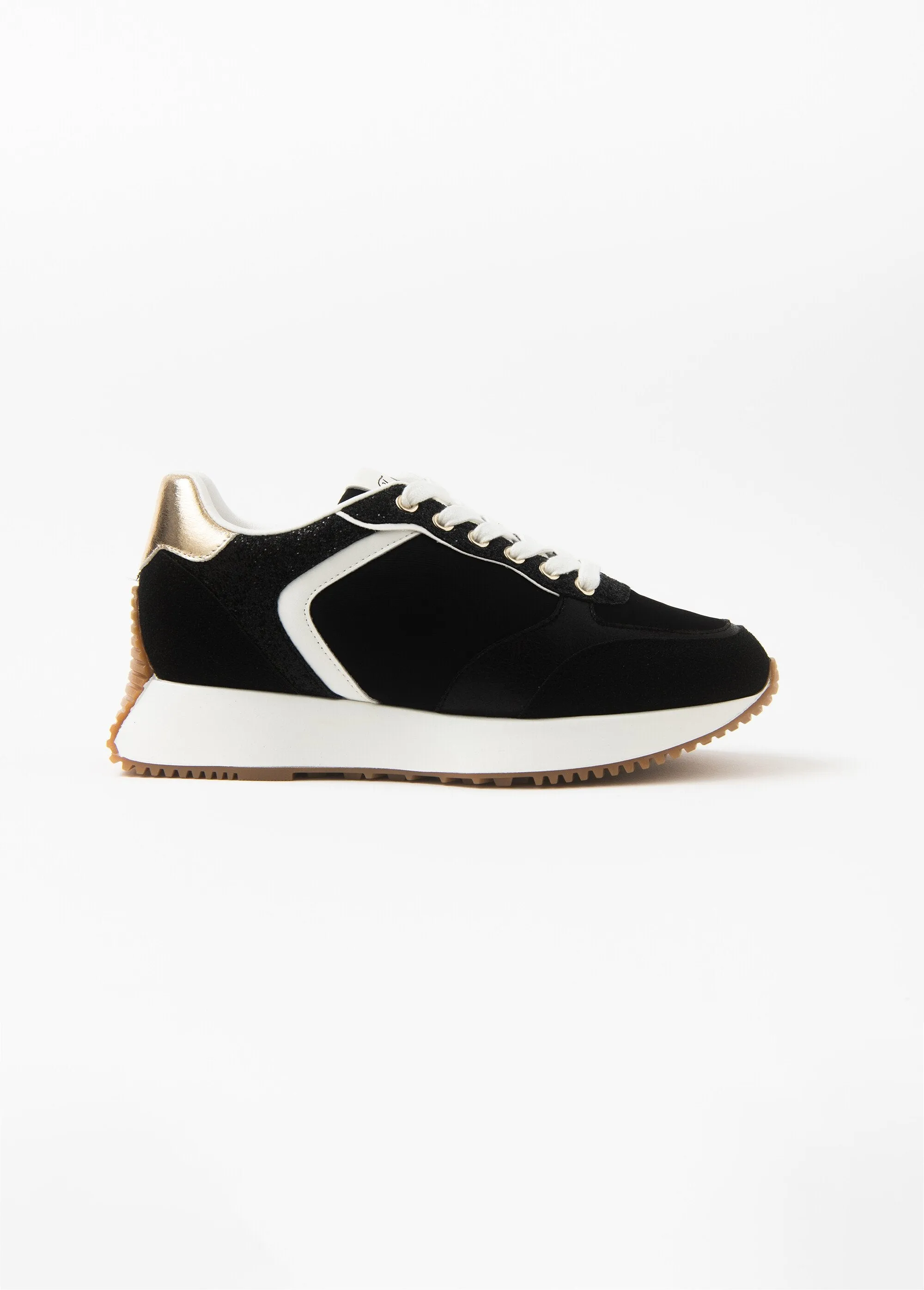 Black sneakers with gold detail and thick sole