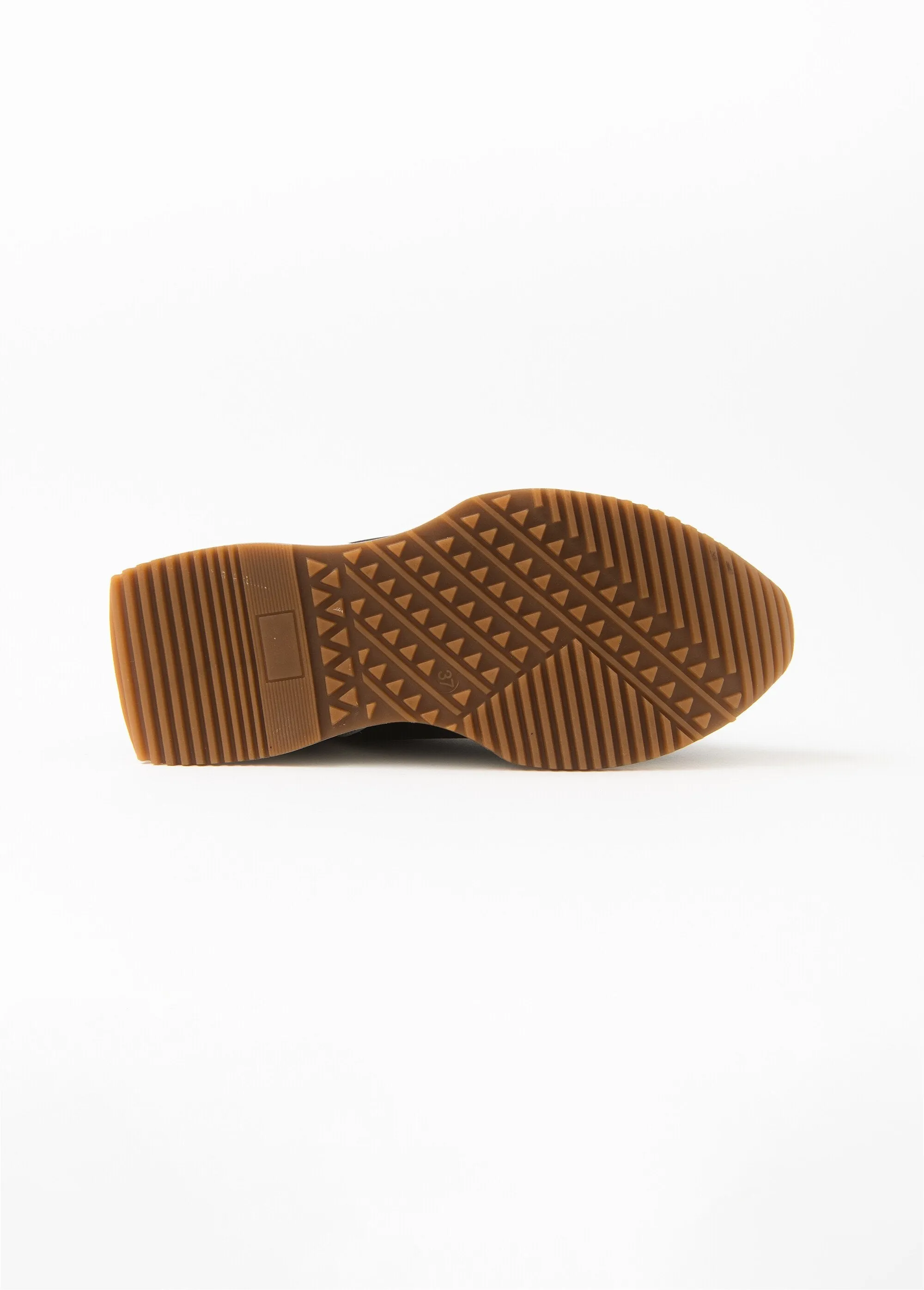 Black sneakers with gold detail and thick sole