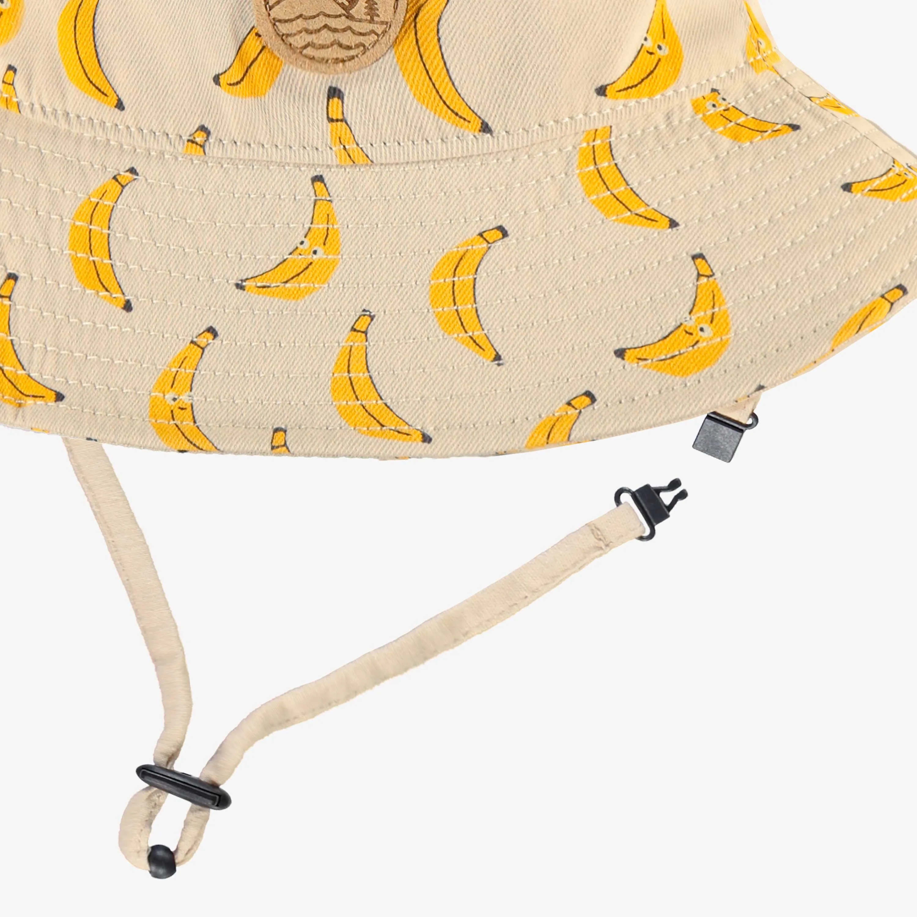 Chapeau de soleil beige en twill à motifs de bananes, enfant || Beige twill sun hat with banana all over print, child